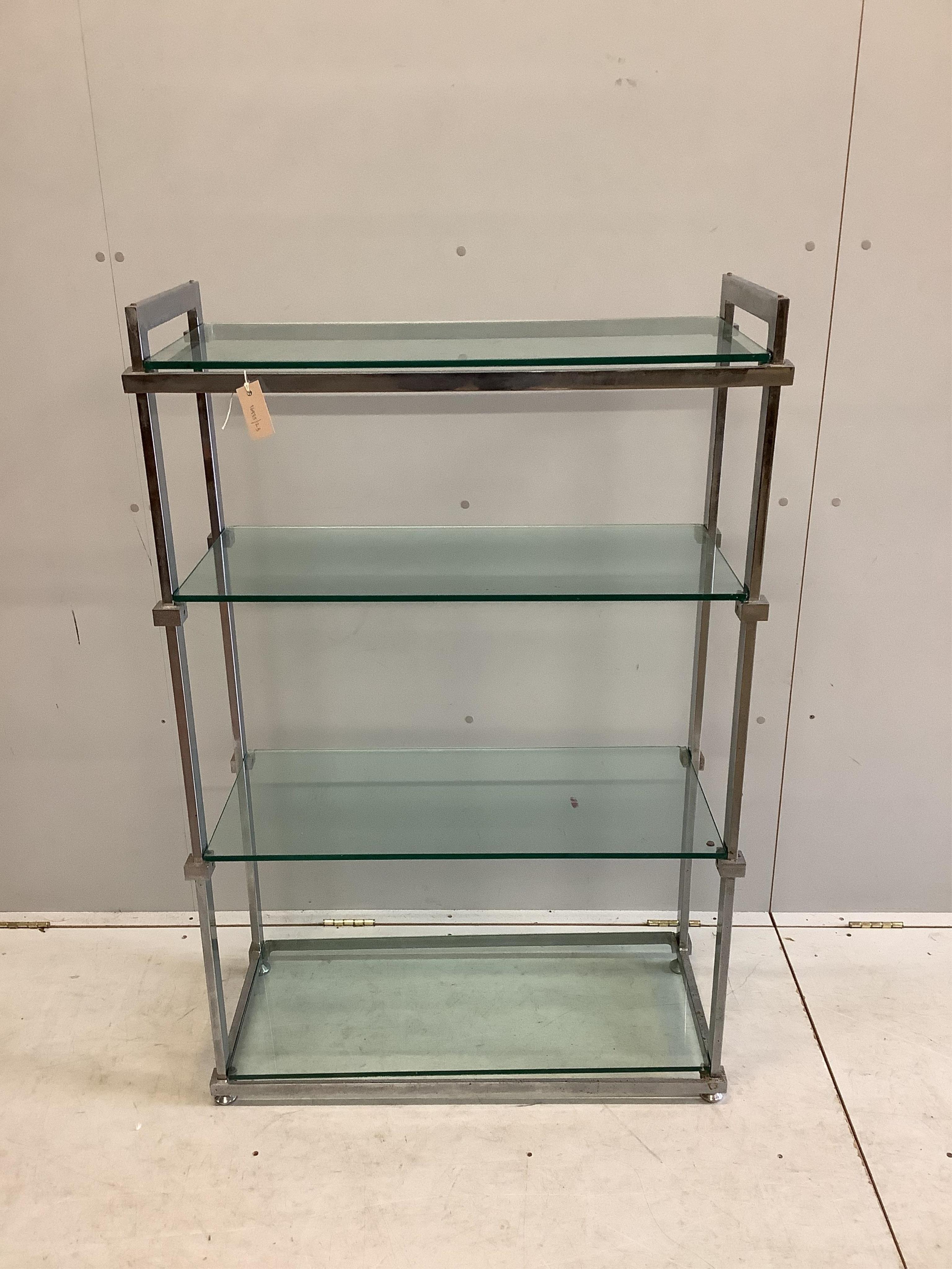 A chrome and glass four tier shelf unit, width 86cm, depth 38cm, height 130cm. Condition - fair